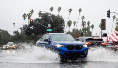 A vehicle crosses a flooded roadway in Pasadena, Calif., on Saturday, Nov. 15, 2025. (AP Photo/Noah Berger)