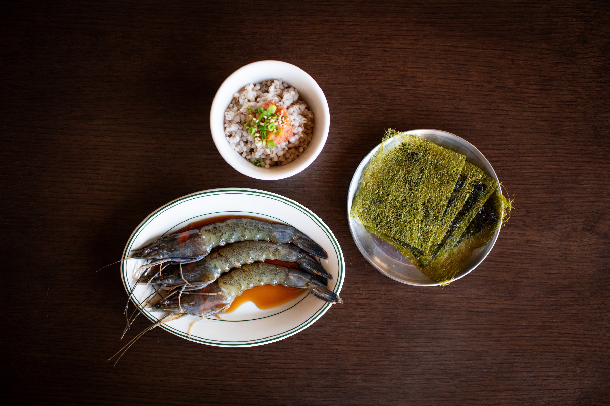 Soy-marinated blue prawns with pollack roe over barley rice and Gamte seaweed.