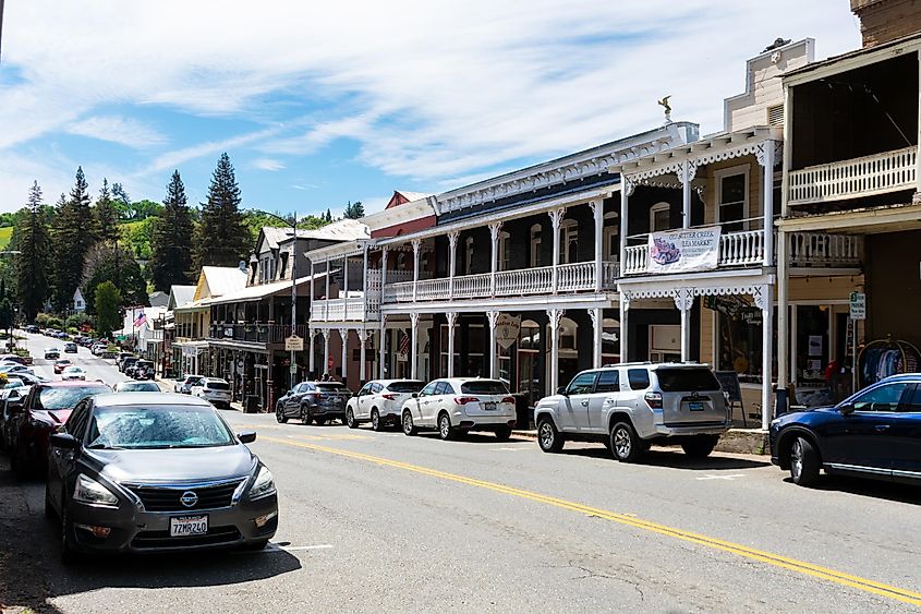 Main Street in historic downtown Sutter Creek, California, lined with 19th-century buildings.