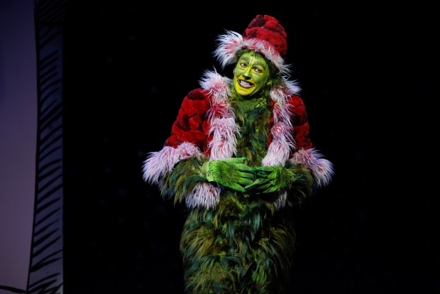 Andrew Polec as the Grinch in the Old Globe's 2024 production of "Dr. Seuss's How the Grinch Stole Christmas!" musical. A new Spanish-language version of the musical will premiere in November in a concert-style staged reading at the Globe. (Rich Soublet II)