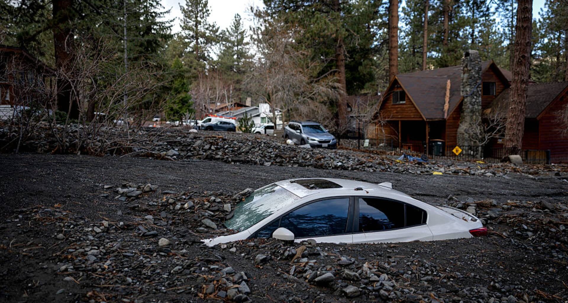 Rain-soaked California still at risk of floods and high surf