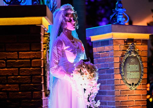 Constance Hatchaway, also known as The Black Widow Bride, from The Haunted Mansion ride at Disneyland, has a beating red heart and a bouquet of flowers with a hatchet inside, during the Frightfully Fun Parade at Oogie Boogie Bash, A Disney Halloween Party, in California Adventure at the Disneyland Resort in Anaheim, CA, on Thursday, September 9, 2021. (Photo by Jeff Gritchen, Orange County Register/SCNG)