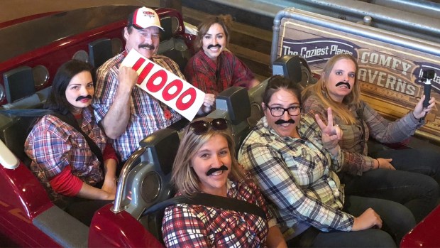 Radiator Springs Racers record-holder Jon Hale marks his 11,000th ride with some friends in fake mustaches and plaid shirts. (Courtesy of Jon Hale)