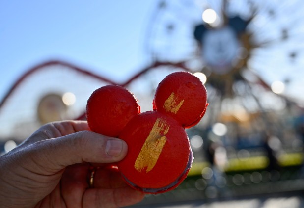 Mickey Mouse-shaped Purple Sweet Potato Macaron: Red macaron filled with purple sweet potato buttercream and a crème fraîche center available at Bamboo Blessings during Lunar New Year at Disney California Adventure in Anaheim, CA, on Jan. 20, 2023. (Photo by Jeff Gritchen, Orange County Register/SCNG)