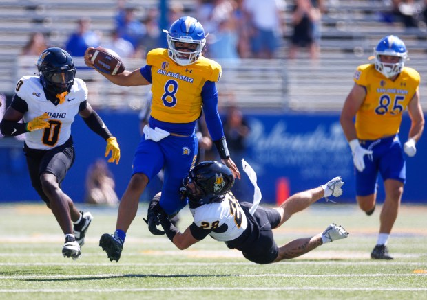 San Jose State's Tama Amisone (8) runs with the ball against Idaho's Matt Irwin (28) in the first quarter at CEFCU Stadium in San Jose, Calif., on Saturday, Sept. 20, 2025. (Shae Hammond/Bay Area News Group)