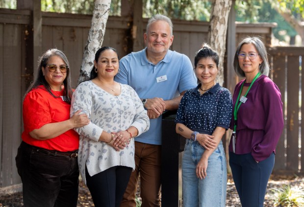 Parents Helping Parents staff and clients, from left, Resource Specialist Zemar Pina Sanchez, client Alba Vivas, client Thu Buu Vien, Chief Development Officer, Mark Fishler, and Education Specialist, Vivian Trieu, at the Parents Helping Parents office in San Jose, Calif., on Thursday, Sept. 25, 2025. The non-profit organization offers workshops, support groups, and leadership training to families with children who have disabilities. (Doug Duran/Bay Area News Group)