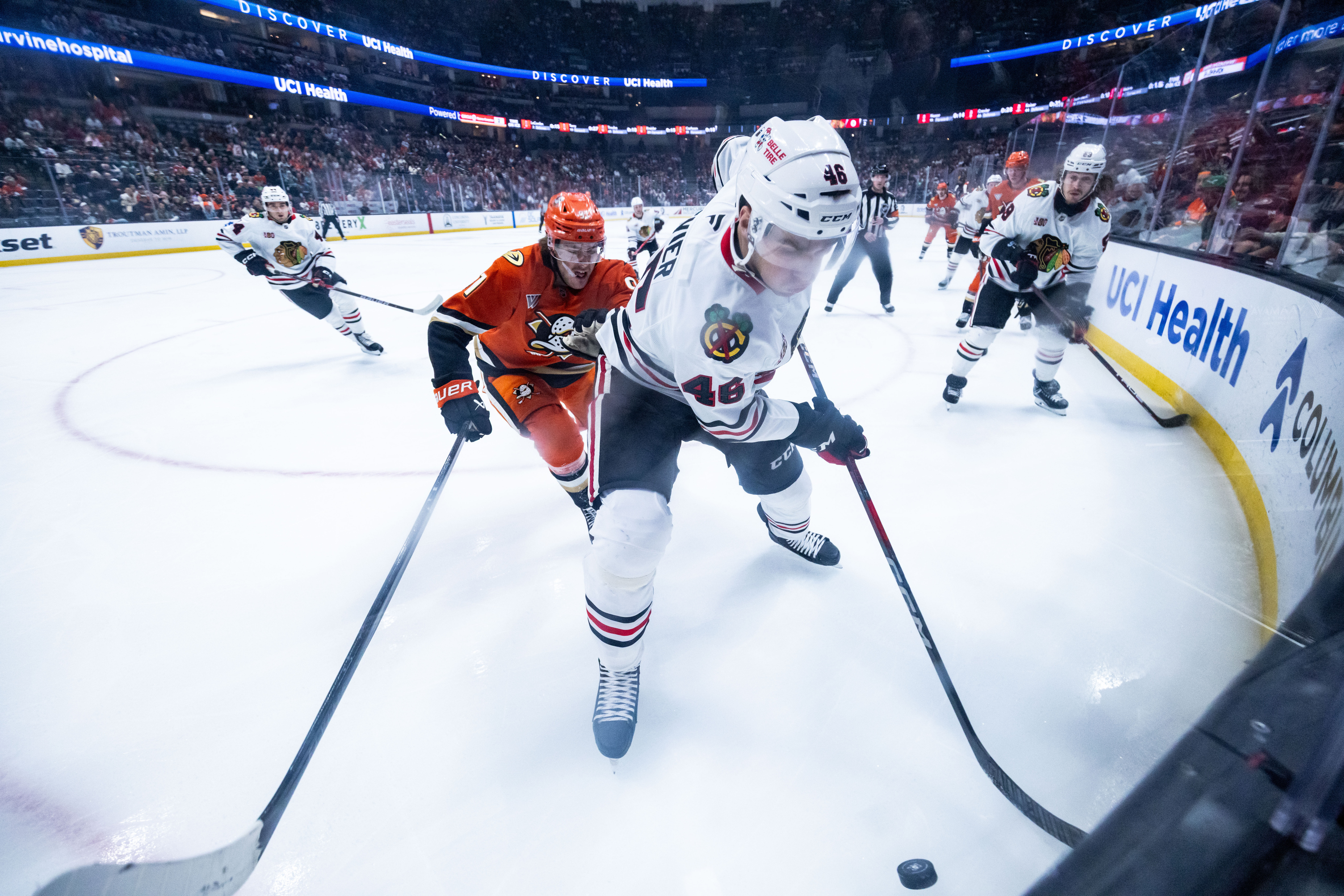 Chicago Blackhawks defenseman Louis Crevier (46) defends the puck against...