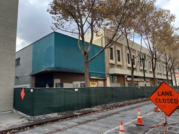 A partially demolished building at 39, 45, and 49 North First Street in downtown San Jose, fenced-off front side, seen on Nov. 20, 2025. (George Avalos/Bay Area News Group)