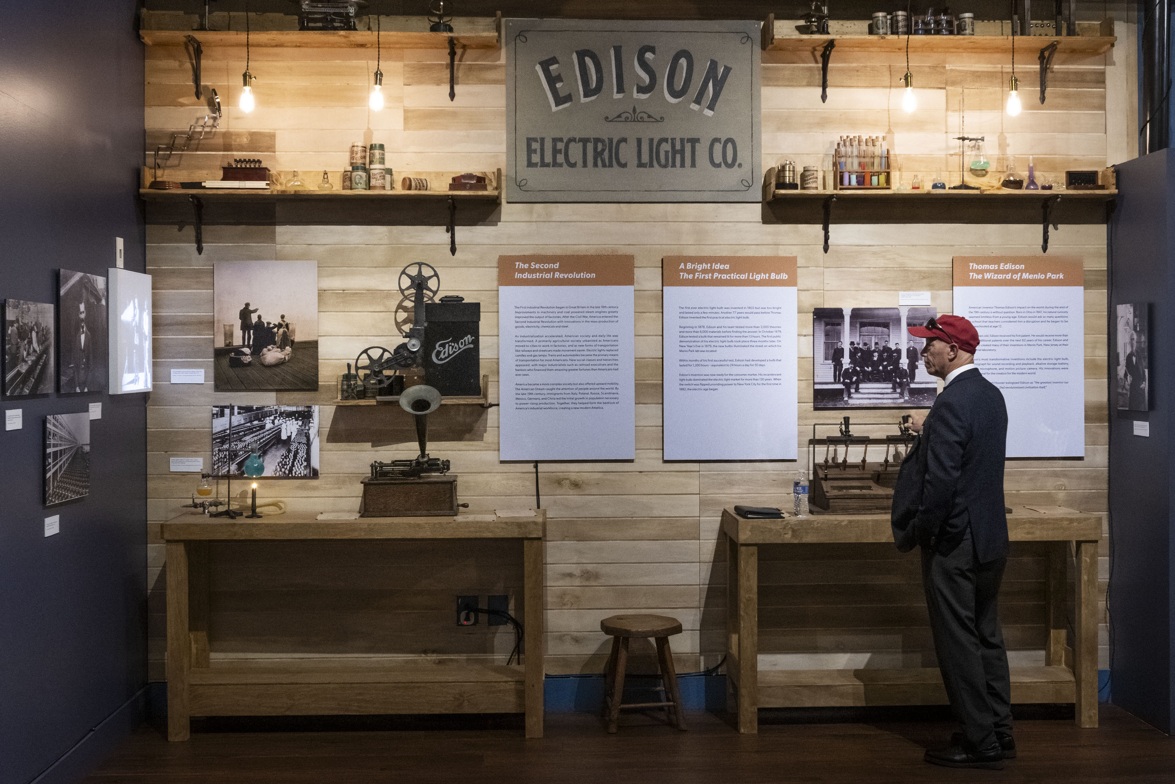 Docent Greg Baranack looks over a display on Thomas Edison...
