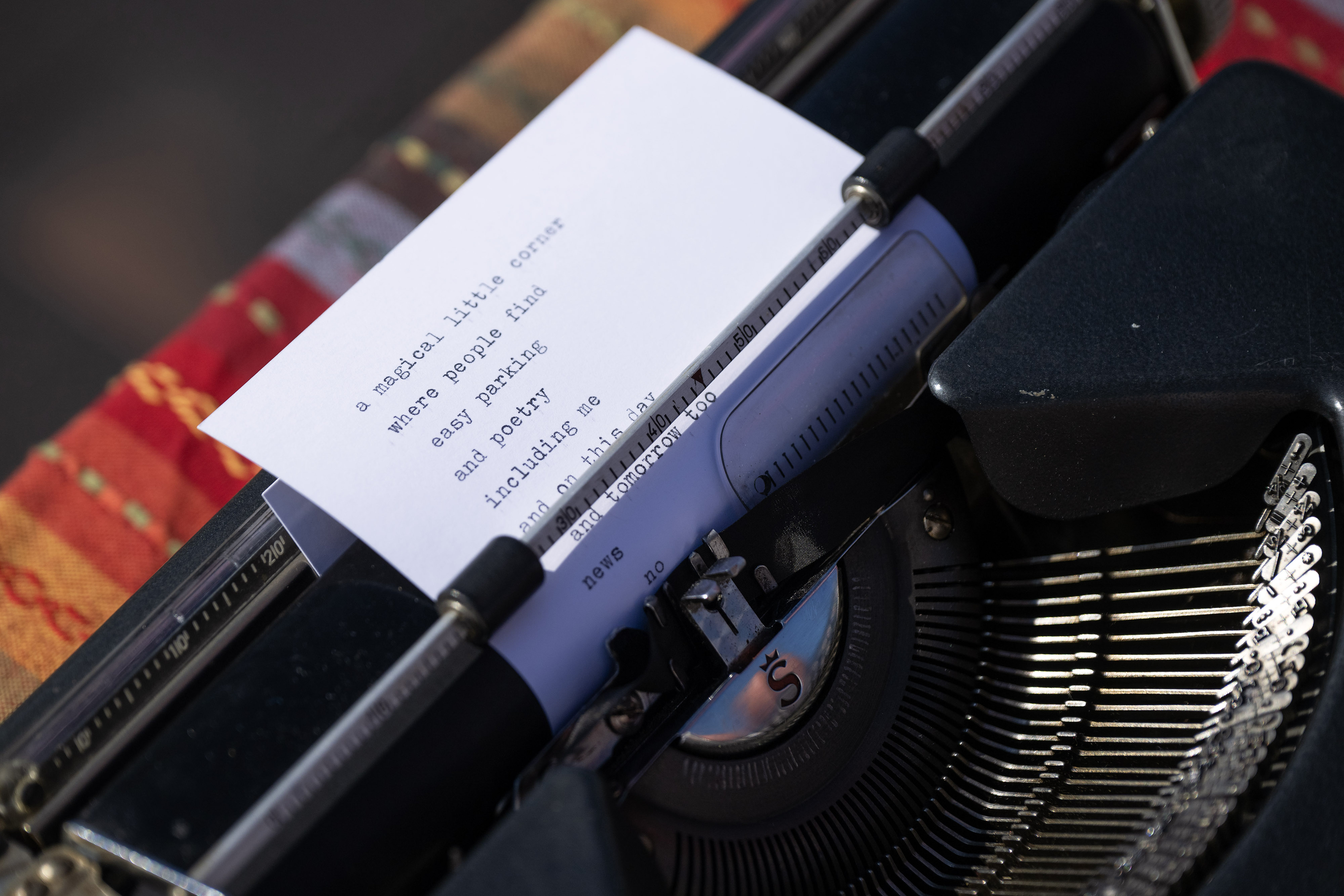 Street poet Nico Patino writes a poem on 2nd St....