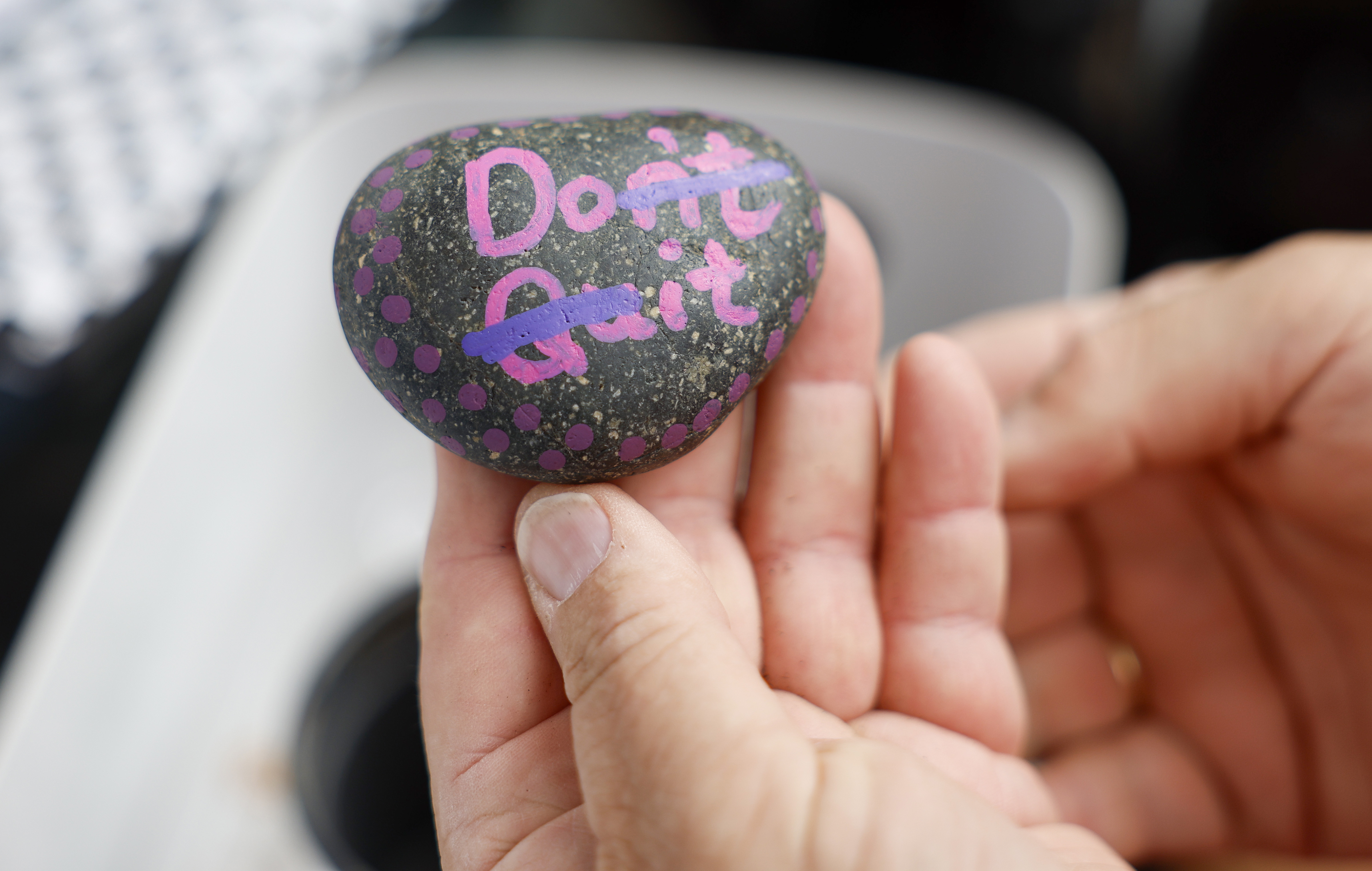 Marisa Carlini shows off a rock she painted at her...