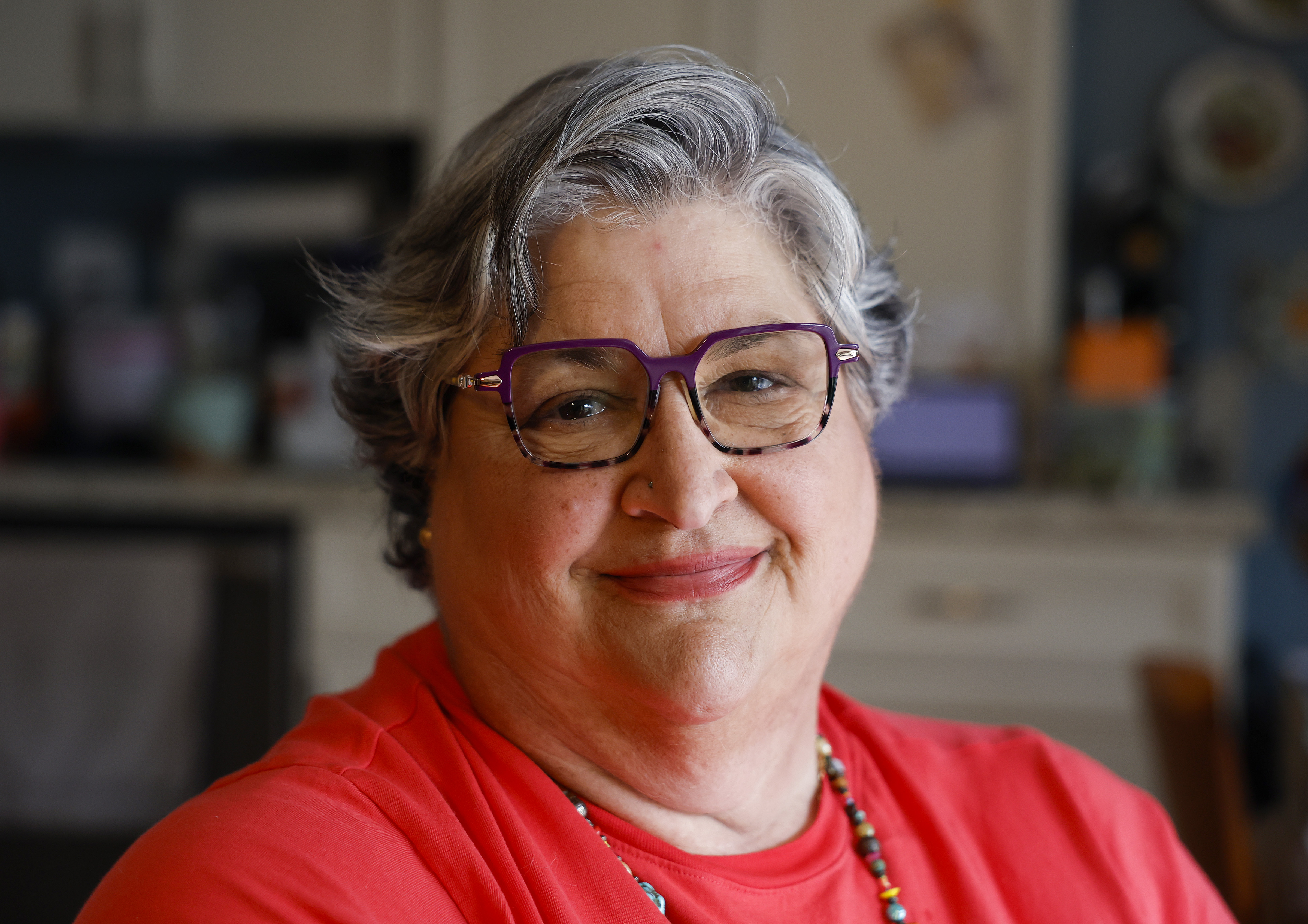 Marisa Carlini poses for a photograph in her home in...