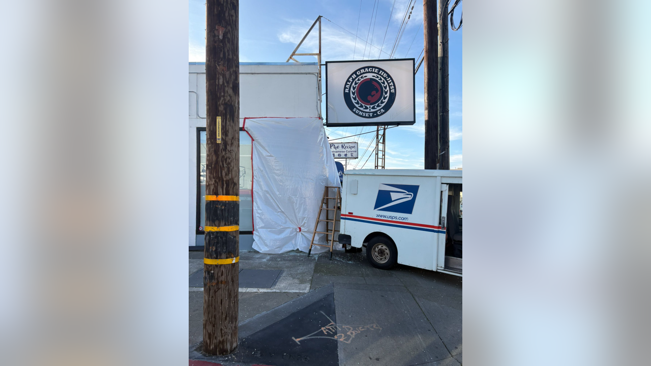 USPS truck backs into building in San Francisco Sunset