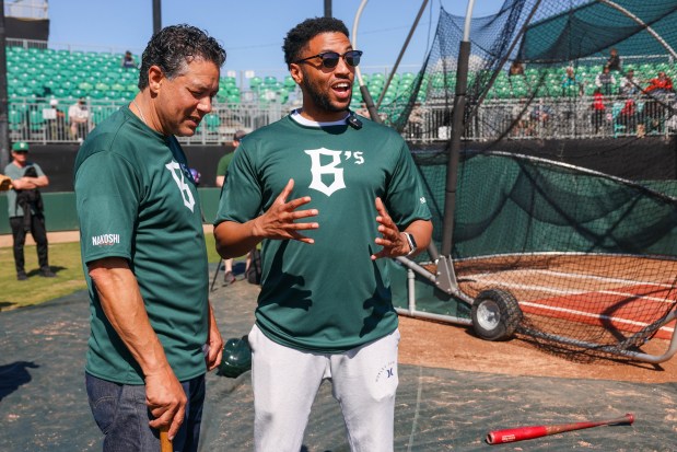 Oakland City Councilmember Ken Houston, left, and Oakland Interim Mayor Kevin Jenkins react after participating during the Oakland Ballers open tryouts at Raimondi Park in Oakland, Calif., on Saturday, March 8, 2025. (Ray Chavez/Bay Area News Group)