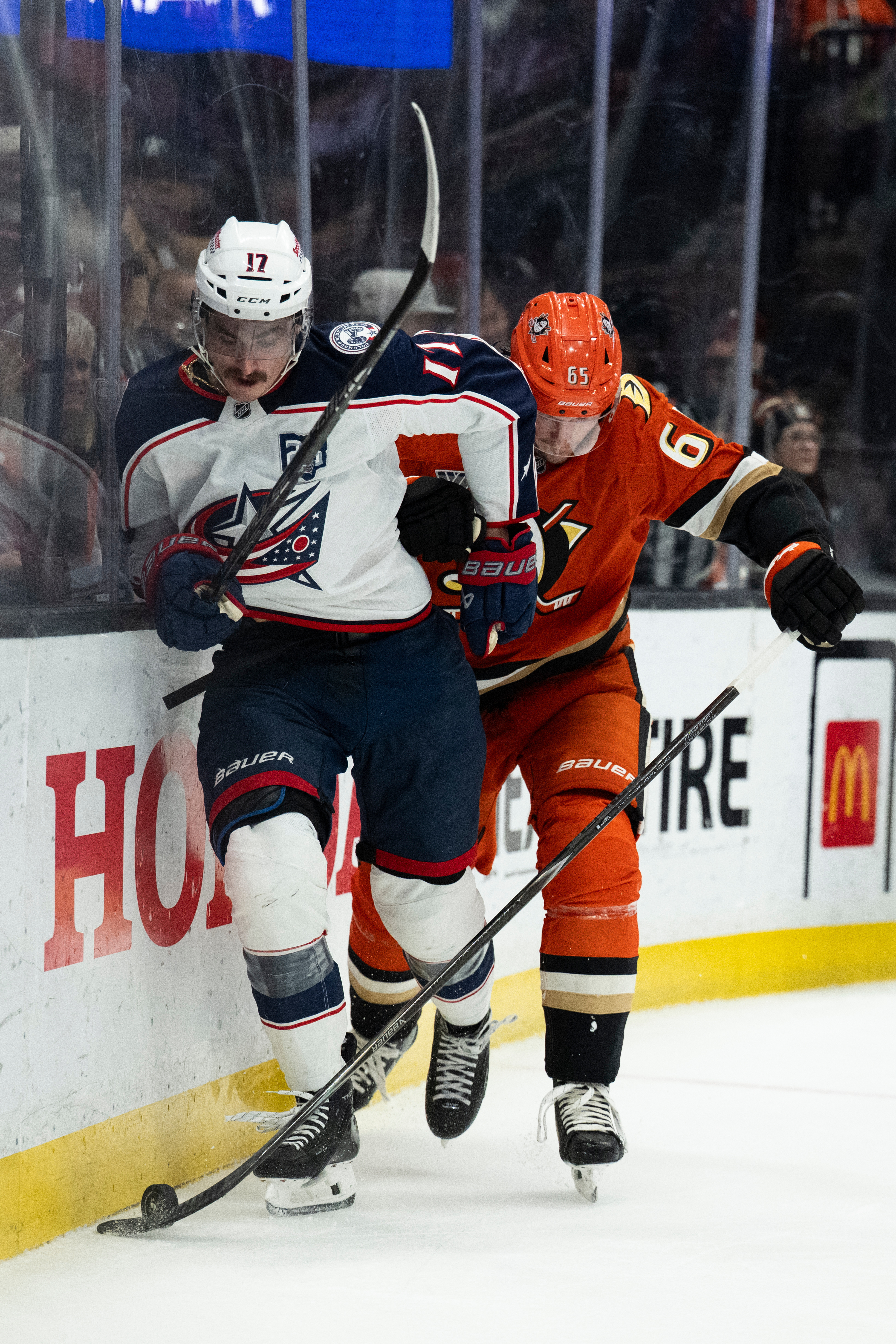 Columbus Blue Jackets left wing Mason Marchment, left, vies for...