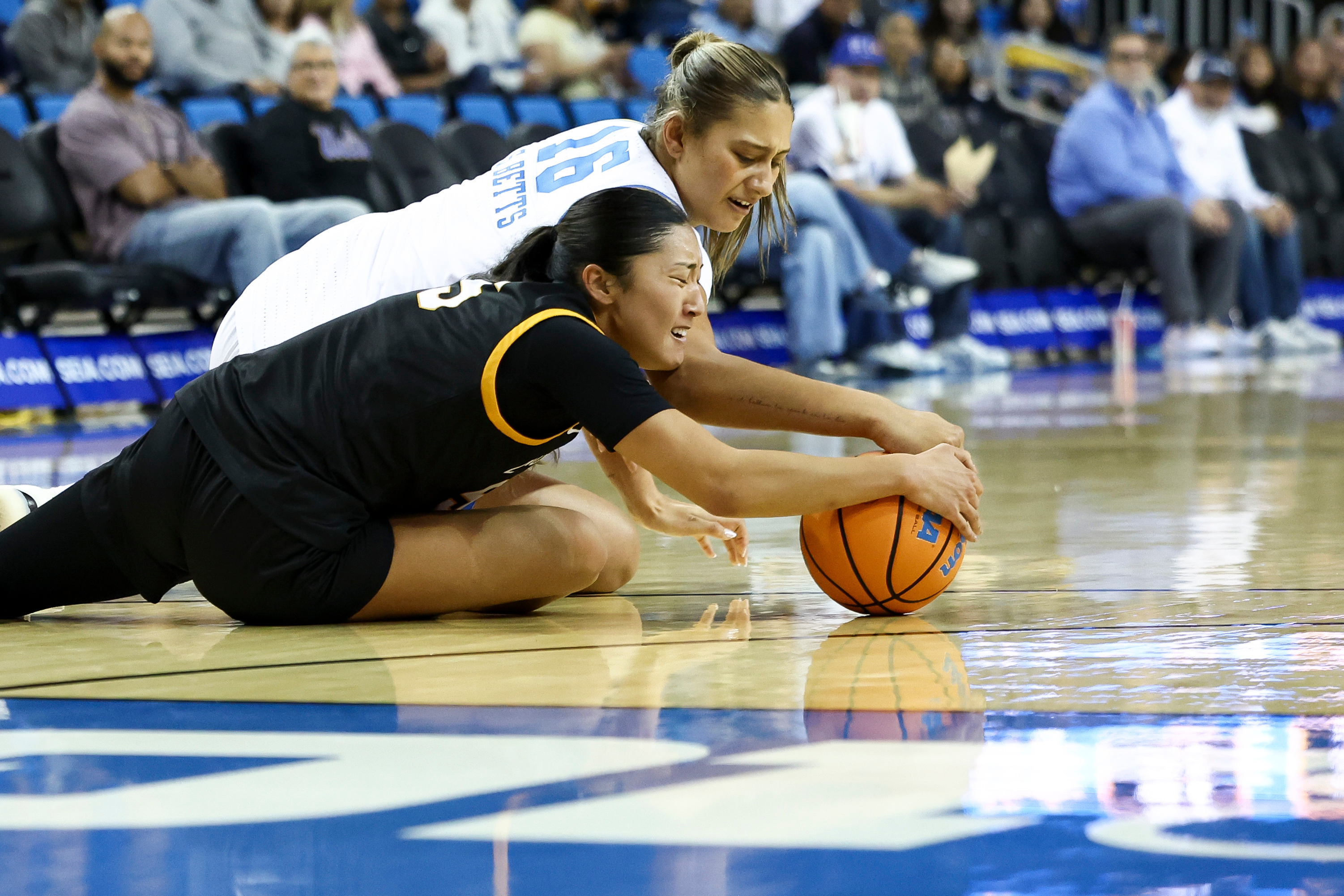 UCLA forward Sienna Betts (16) and Long Beach State forward...