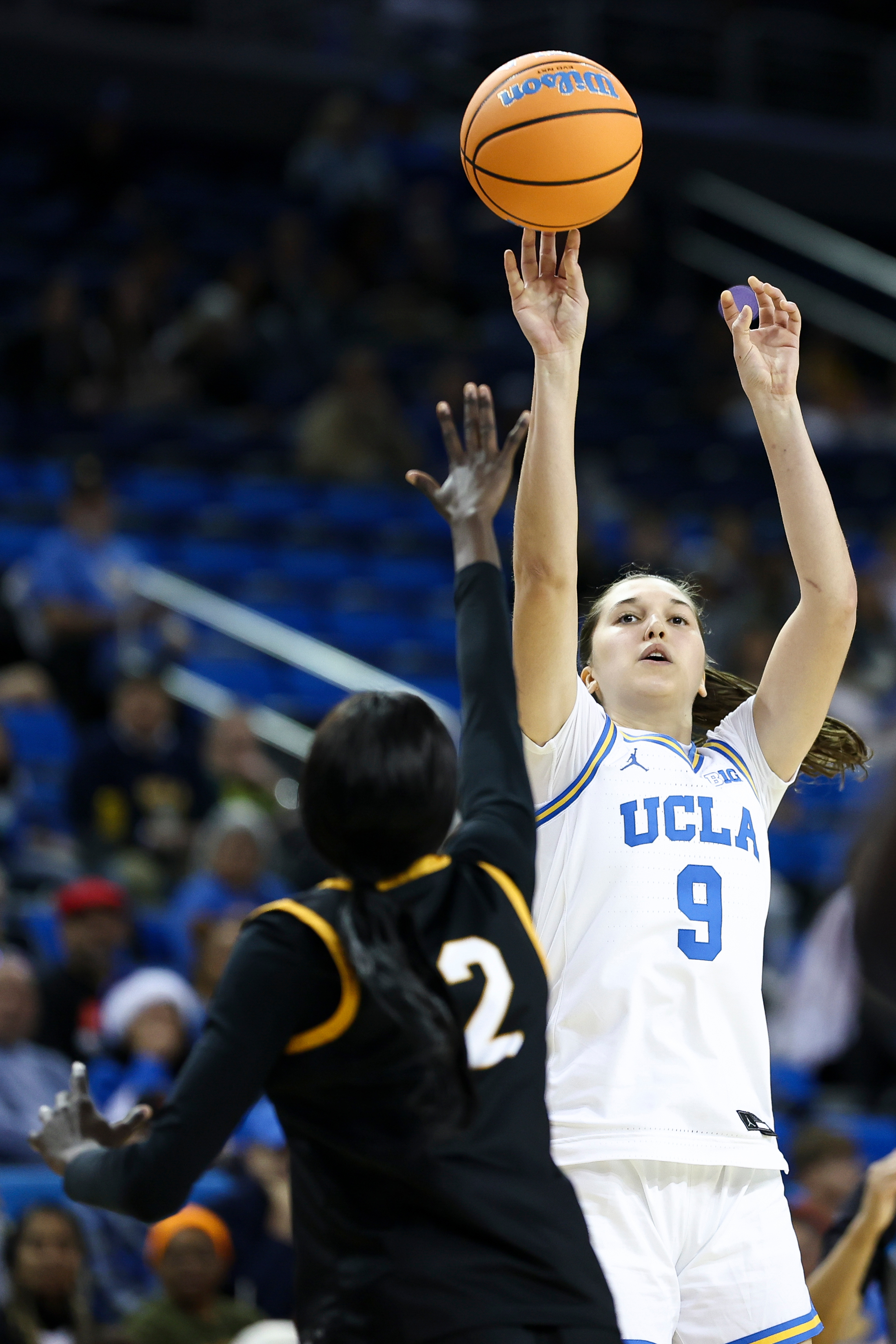 UCLA guard Lena BiliÄ (9) shoots against Long Beach State...