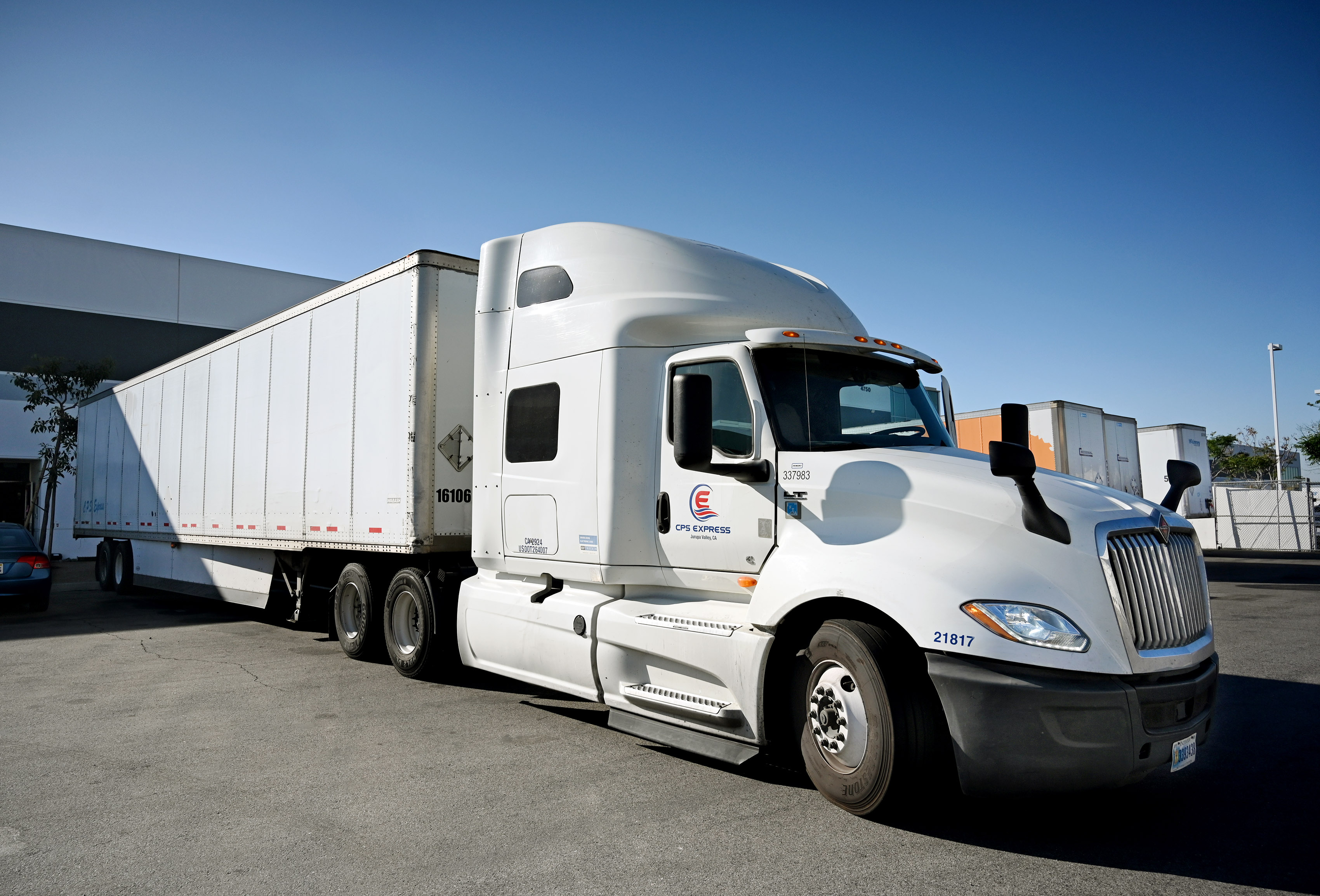 A CPS Express tractor trailer prepares to depart the loading...