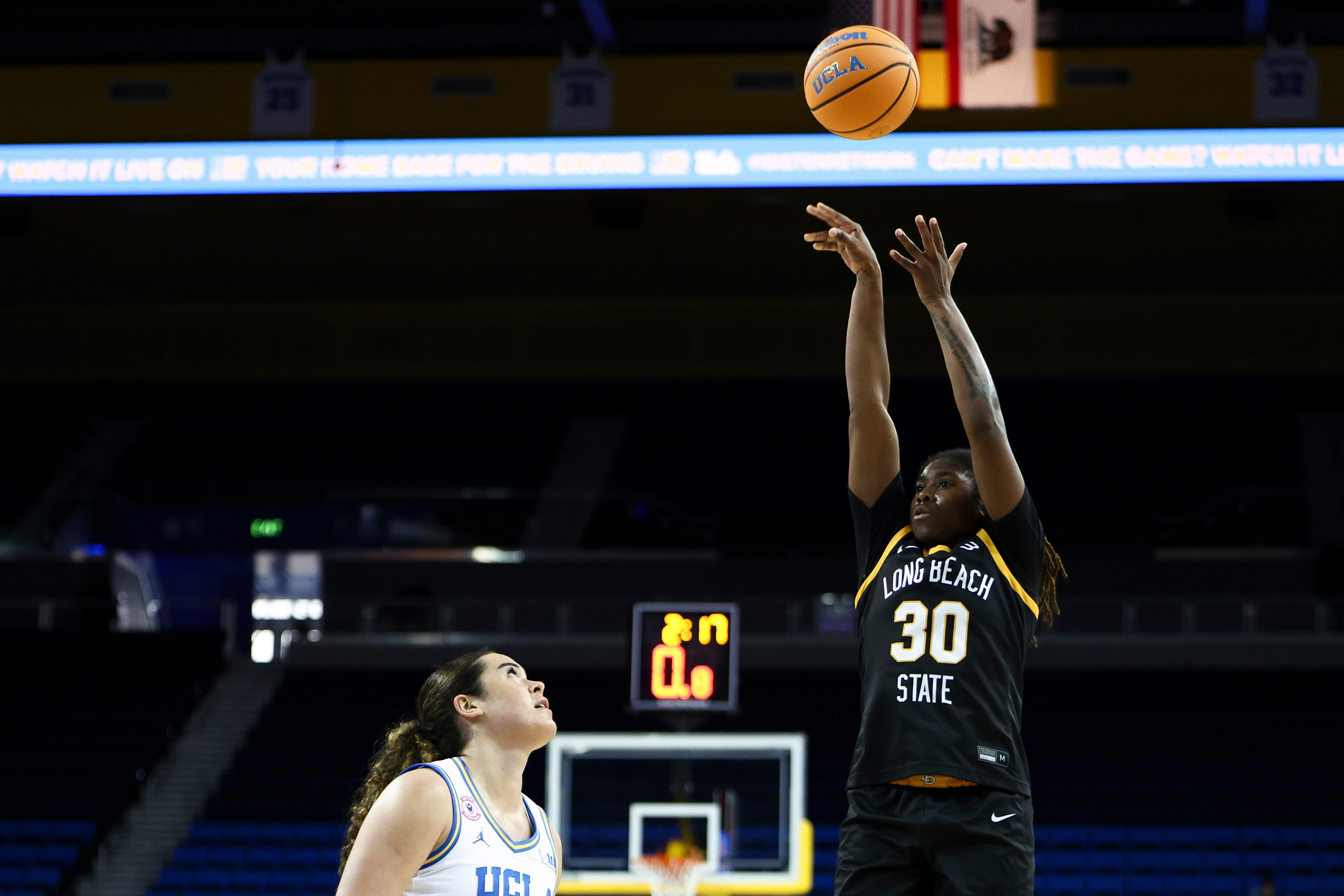 Long Beach State guard Jaquoia Jones-Brown (30) shoots against UCLA...