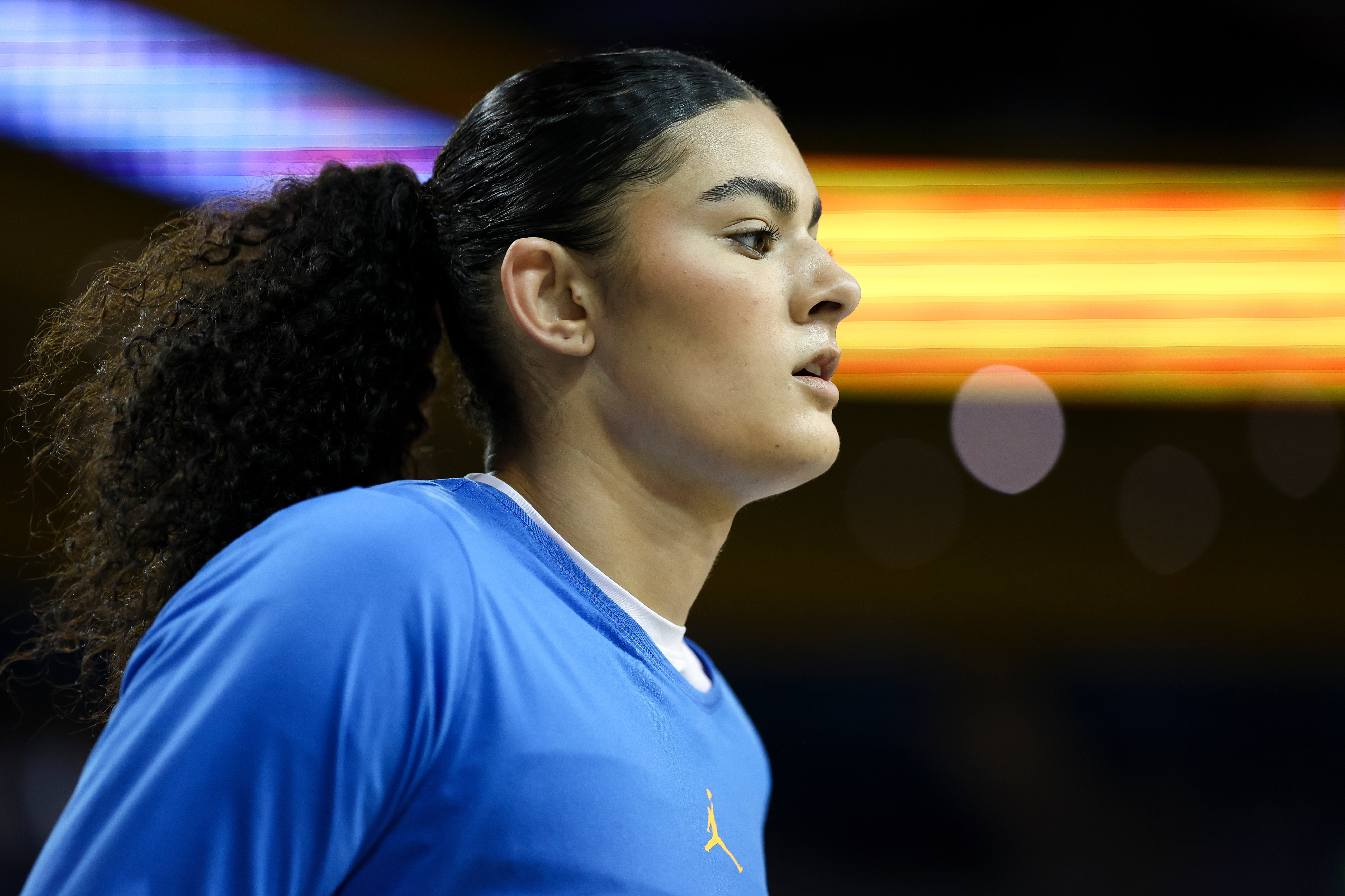 UCLA center Lauren Betts looks on before an NCAA college...