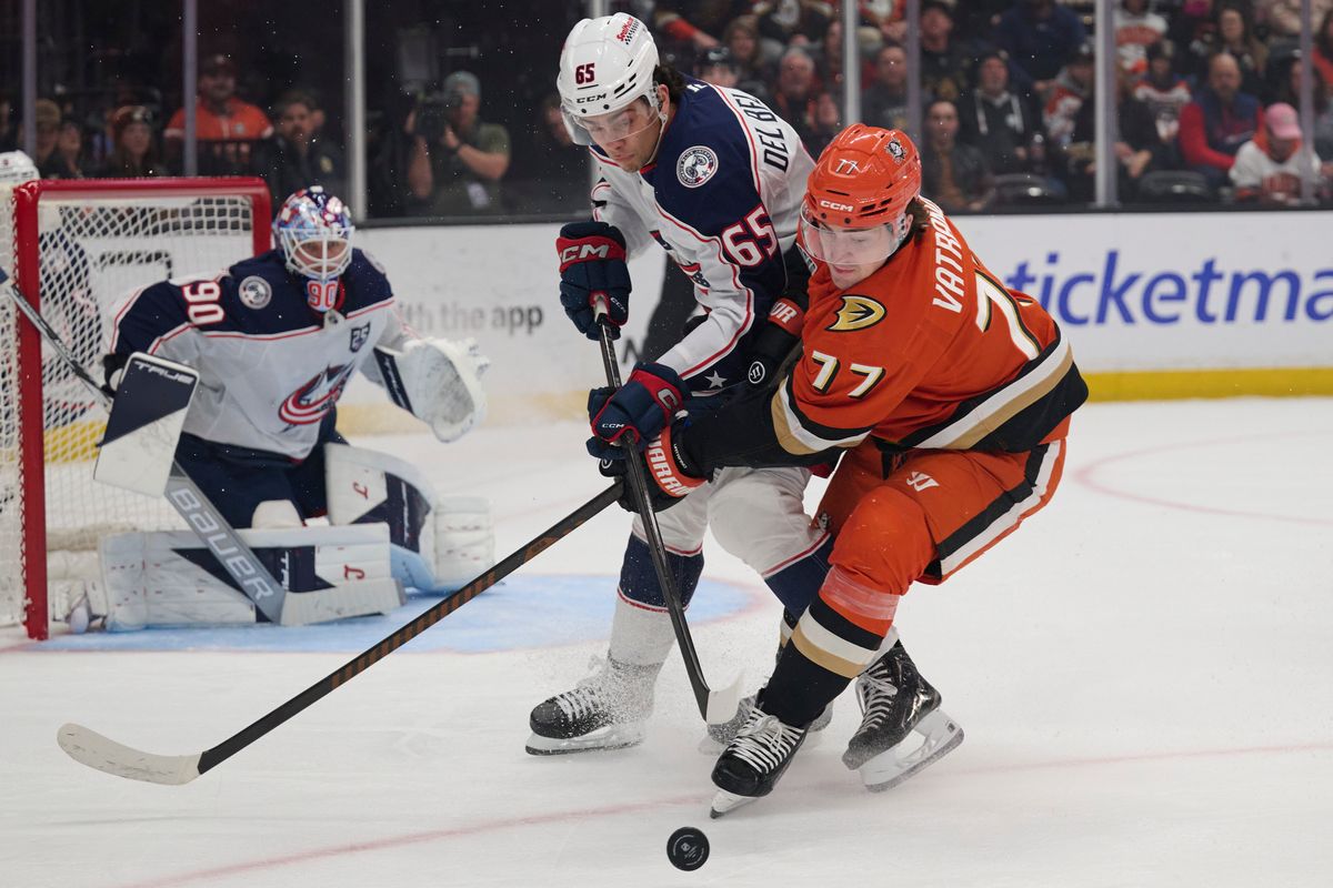 Frank Vatrano #77 of the Anaheim Ducks fights for the puck  against the Blue Jackets at the Honda Center on December 20,2025 in Anaheim, California.