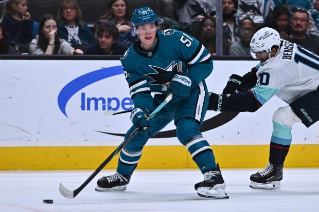 San Jose Sharks' Collin Graf (51) looks to pass the puck while playing the Seattle Kraken in the first period of their NHL game at the SAP Center in San Jose, Calif., on Saturday, Dec. 20, 2025. (Jose Carlos Fajardo/Bay Area News Group)