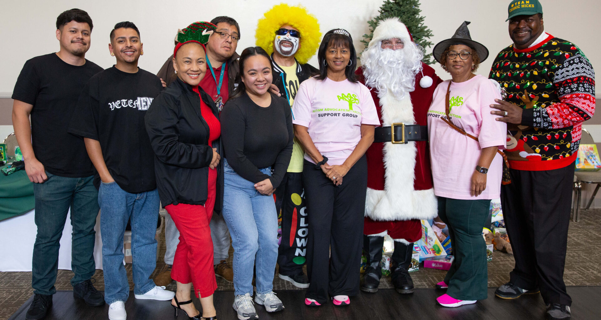 City officials, volunteers, community organizers and Santa Claus take a...