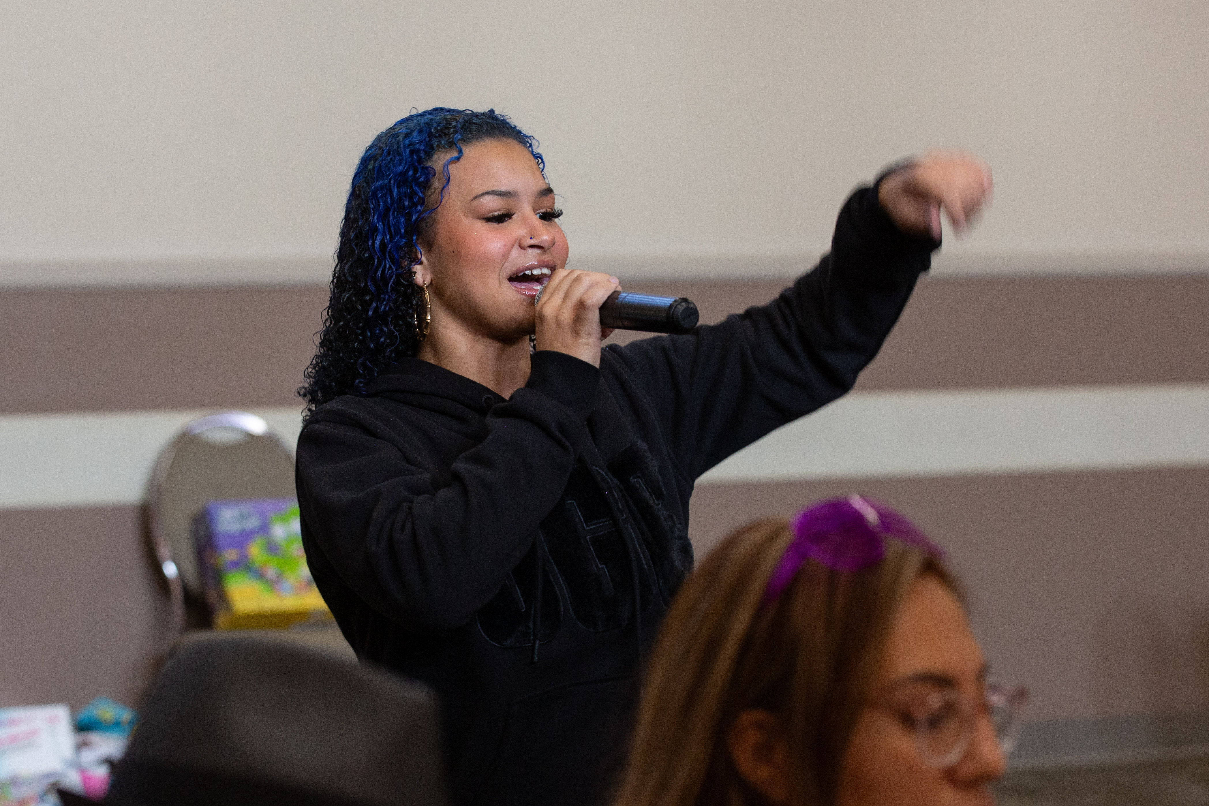Rapper Heaven Ava sings a Christmas song during the annual...