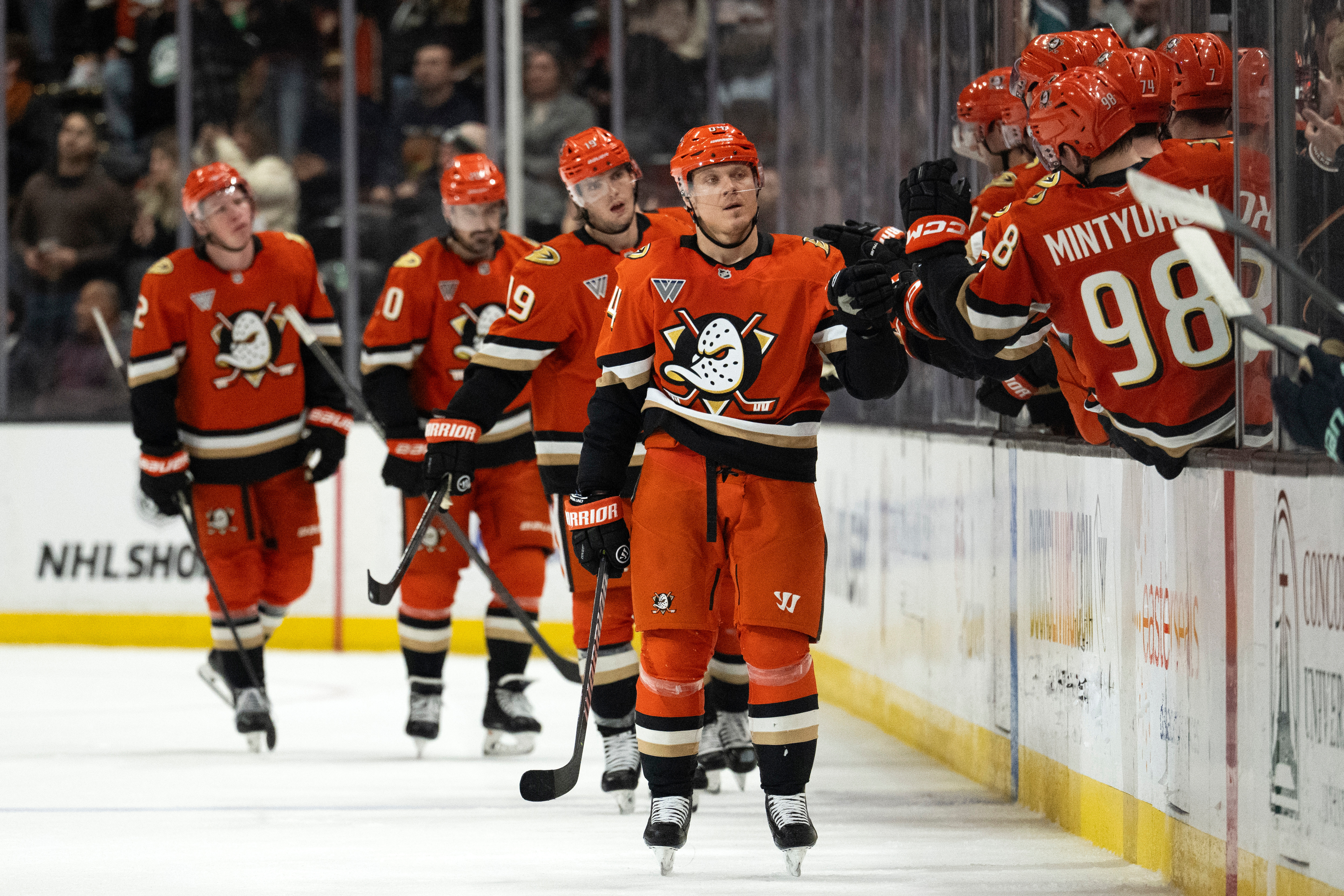 Ducks center Mikael Granlund, center, celebrates with the bench after...