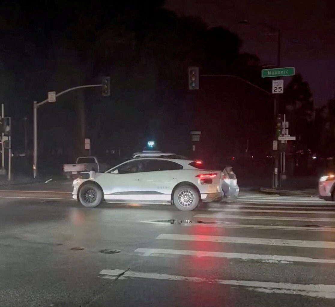 A Waymo car is halted on the road amid a power outage in San Francisco, California, U.S., December 20, 2025, in this screengrab obtained from a social media video.