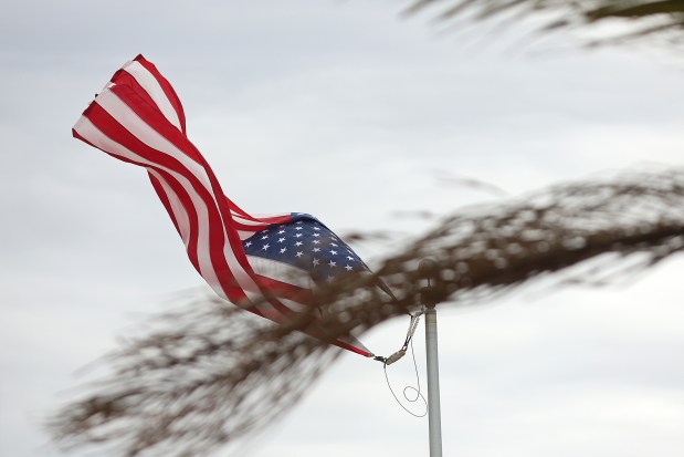 The U.S. flag danced in the wind in Coronado at midday. (John Gastaldo / For The San Diego Union-Tribune)