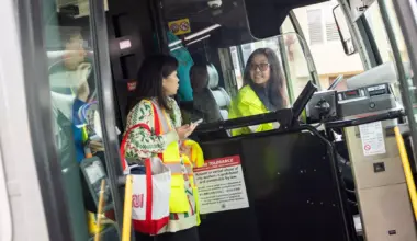 A collage of nine images: an abstract U.S. flag with tech icons, a policewoman driving, a cyclist in a field, a crowd protest, a large red building, a torn photo of a couple, a suburban house with a palm tree, two basketball players celebrating, and a cartoon drag show.