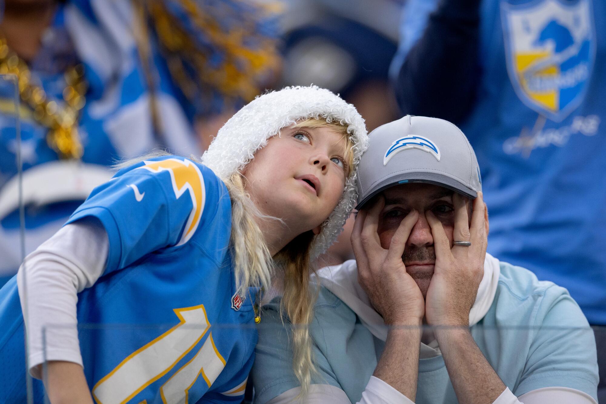 Chargers fans react during the team's 20-16 loss to the Houston Texans at SoFi Stadium on Saturday.
