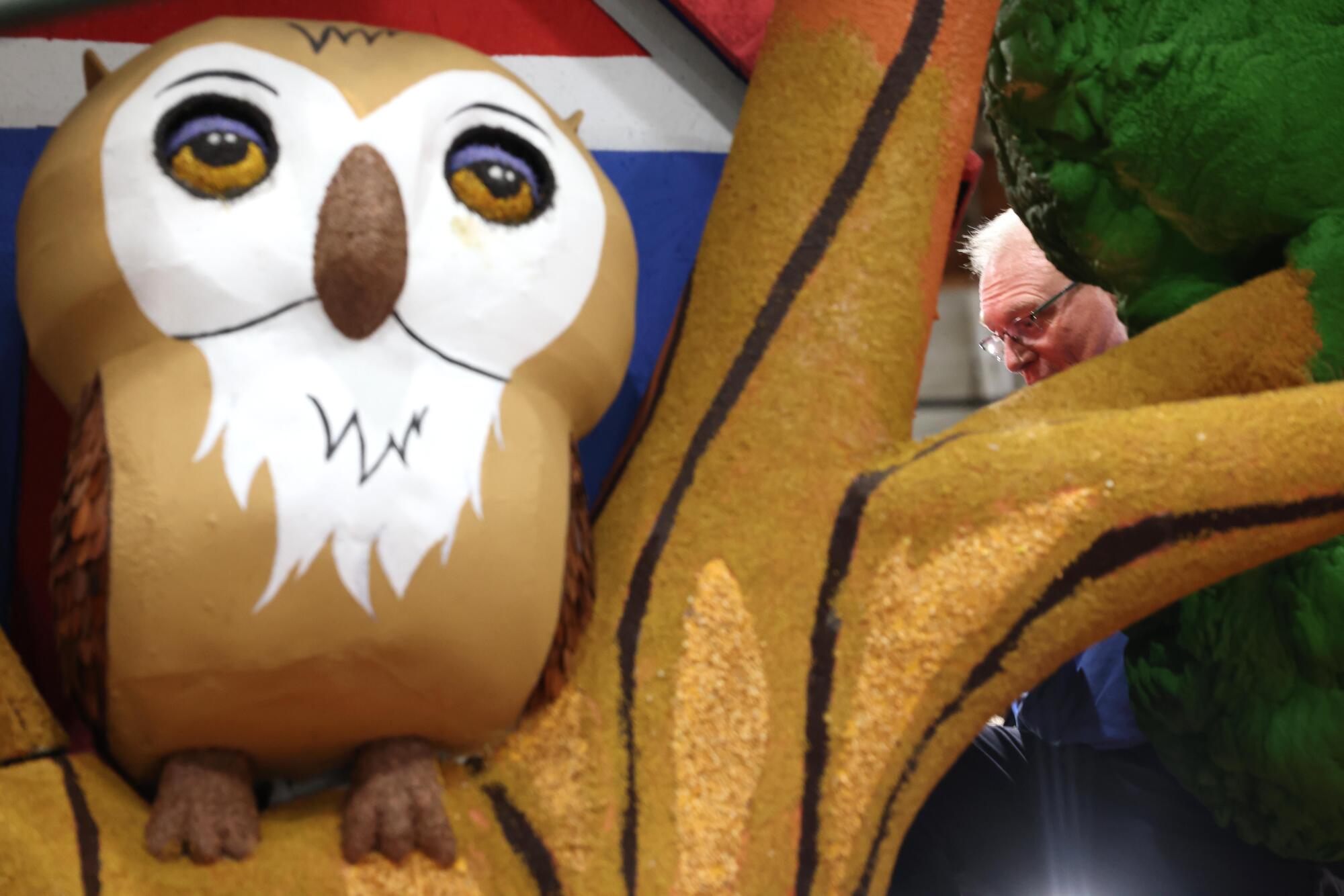 Volunteer Neal Gamble, from Scott City, Kansas, works on the Shriner's Children's float titled, "Build Dreams Together."