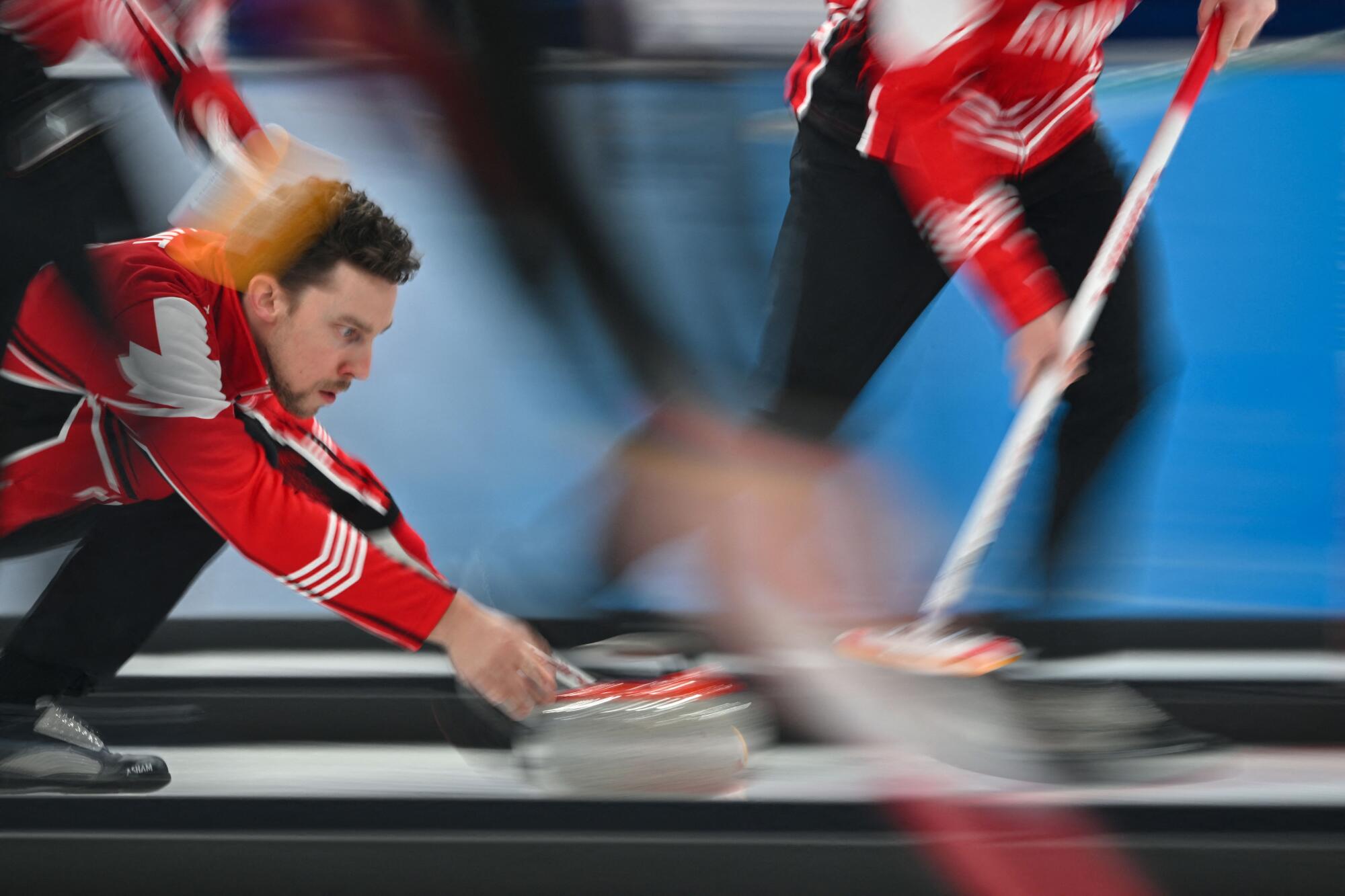 Canada's Brett Gallant curls the stone during the 2022 Winter Olympics in Beijing on Feb. 17, 2022. 