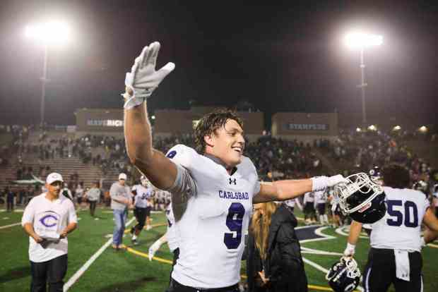Carlsbad's Rocky Cummings #9 celebrates after the Lancers defeated La Costa Canyon during the CIF San Diego Section Open Division semifinal at La Costa Canyon High School on Saturday, Nov. 15, 2025 in Carlsbad, California. (Meg McLaughlin / The San Diego Union-Tribune)