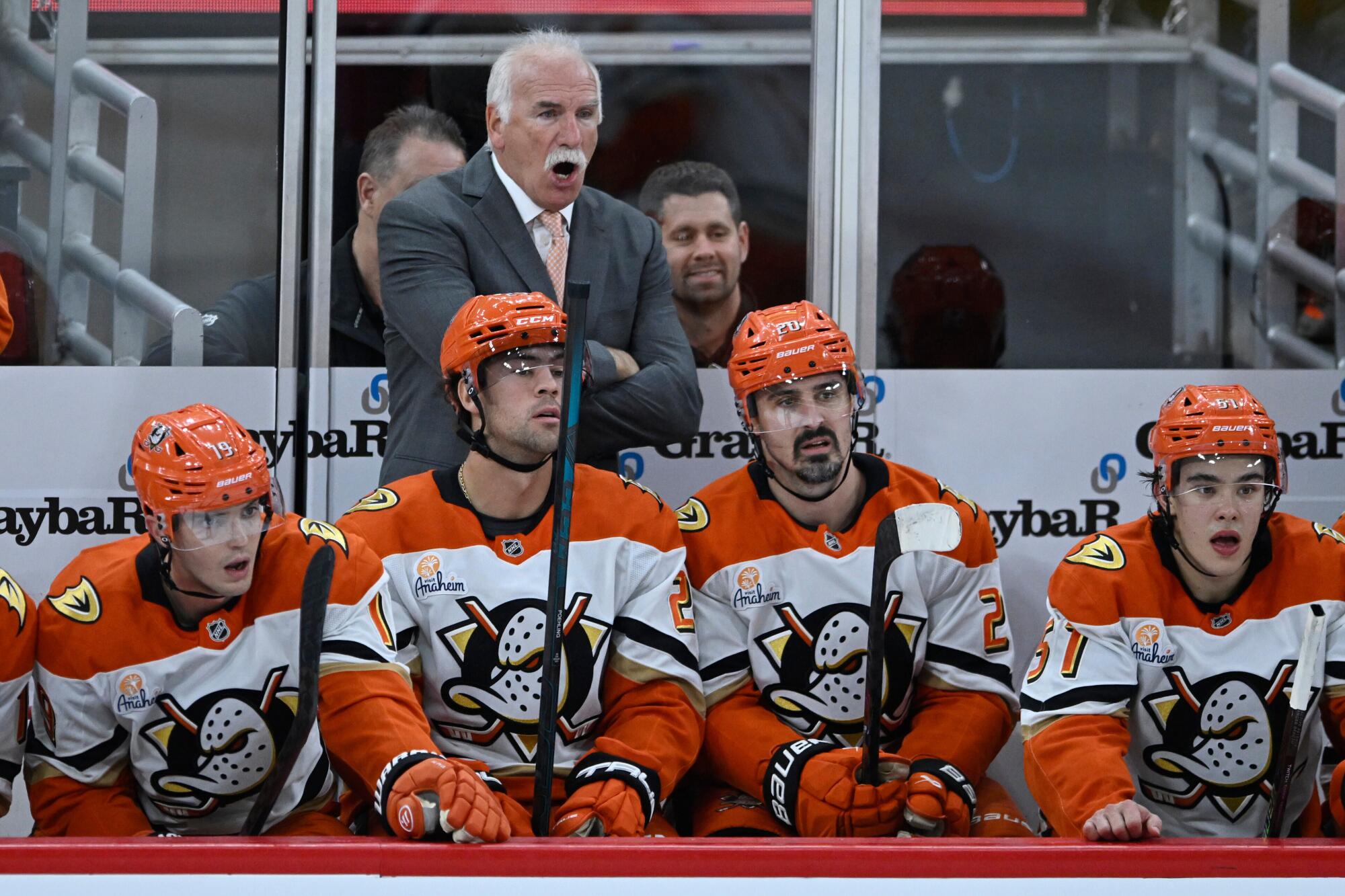 Ducks coach Joel Quenneville yells instructions to his players during a game against the Chicago Blackhawks on Oct. 19.