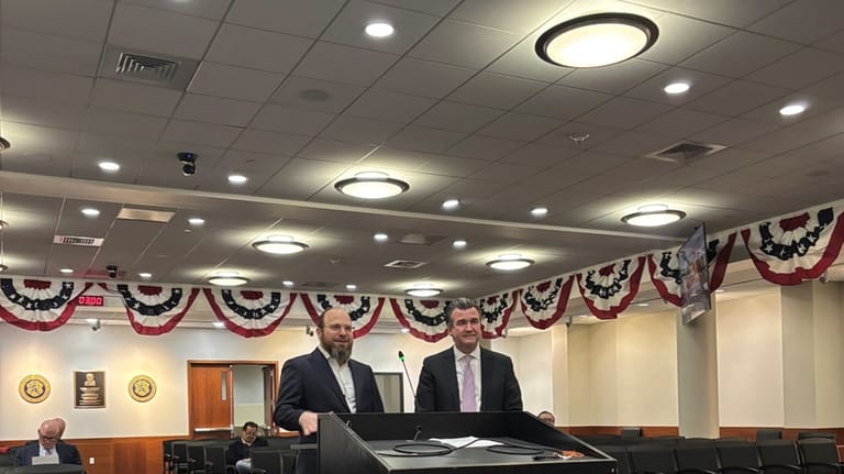 Avraham Walkin, left, an executive with Starock Group, and the...