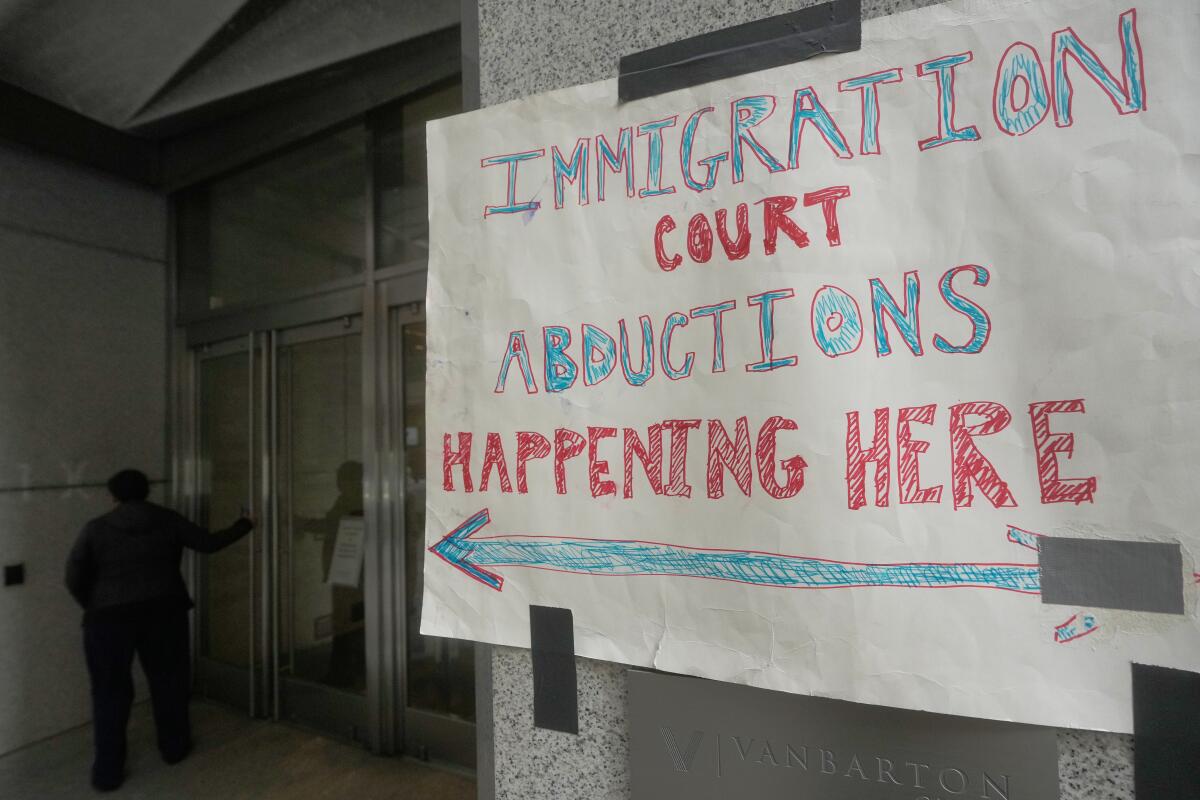 A sign posted outside the San Francisco Immigration Court in October protests enforcement actions by immigration agents. 