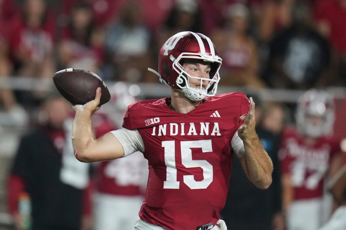 FILE - Indiana quarterback Fernando Mendoza throws during the first half.