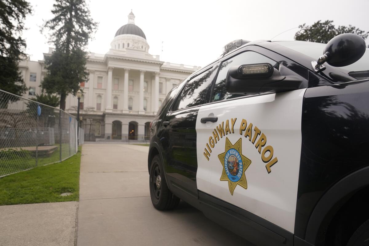 A California Highway Patrol vehicle is parked outside the state Capitol in Sacramento