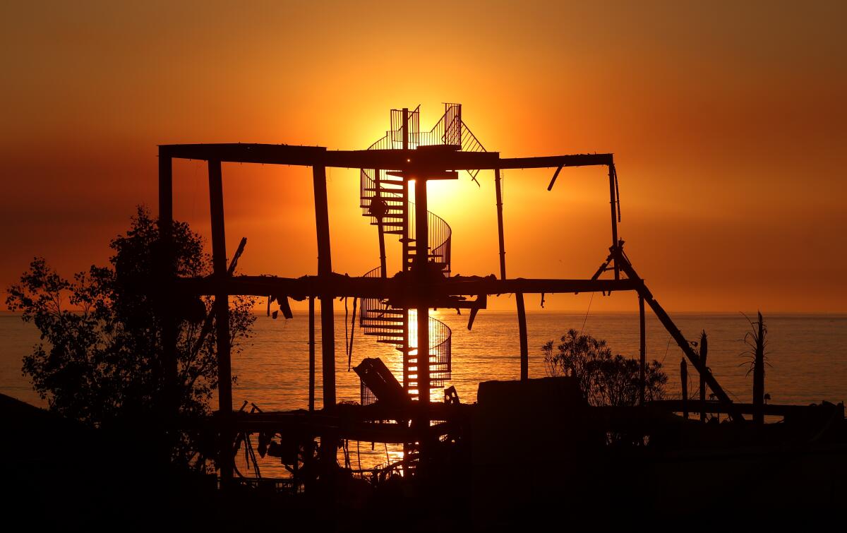 A stairway is all that's left of a house that burned down from the Palisades Fire on PCH in Malibu.