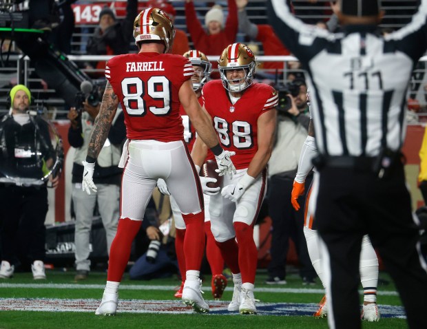 San Francisco 49ers' Jake Tonges (88) celebrates his touchdown with San Francisco 49ers' Luke Farrell (89) against the Chicago Bears in the first quarter at Levi's Stadium in Santa Clara, Calif., on Sunday, Dec. 28, 2025. (Nhat V. Meyer/Bay Area News Group)