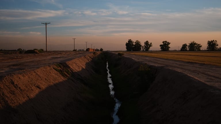 Water sits in a ditch Friday, Dec. 12, 2025, in...