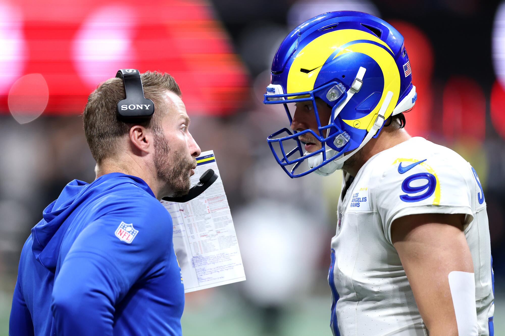 Rams coach Sean McVay speaks with quarterback Matthew Stafford in the fourth quarter Monday against the Falcons.