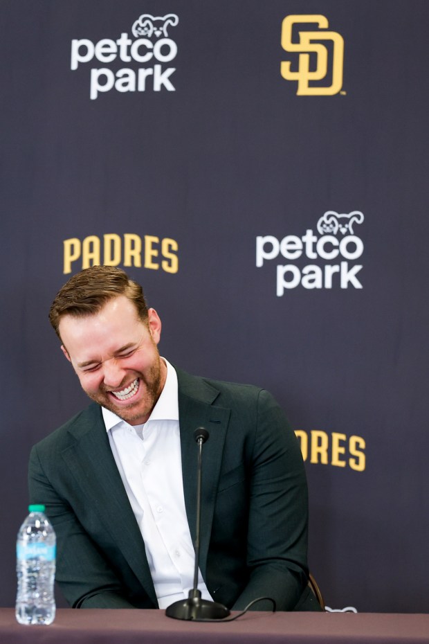 Michael King laughs during a news conference after the Padres re-signed him to a three-year, $75-million contract at Petco Park on Friday, Dec. 19, 2025 in San Diego, California. (Meg McLaughlin / The San Diego Union-Tribune)