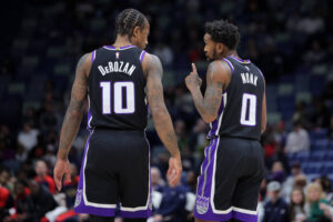 NEW ORLEANS, LOUISIANA - DECEMBER 12: Malik Monk #0 and DeMar DeRozan #10 of the Sacramento Kings react against the New Orleans Pelicans during a game at the Smoothie King Center on December 12, 2024 in New Orleans, Louisiana. NOTE TO USER: User expressly acknowledges and agrees that, by downloading and or using this Photograph, user is consenting to the terms and conditions of the Getty Images License Agreement. (Photo by Jonathan Bachman/Getty Images)