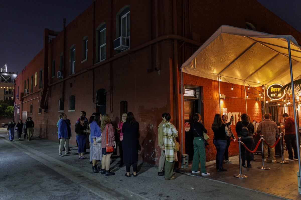 Patrons line up to enter the Hotel Cafe.