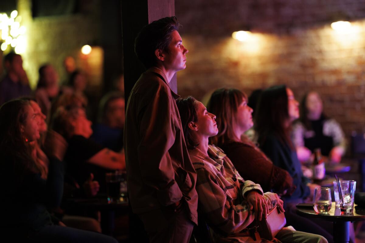Patrons enjoy live music at the Hotel Cafe.