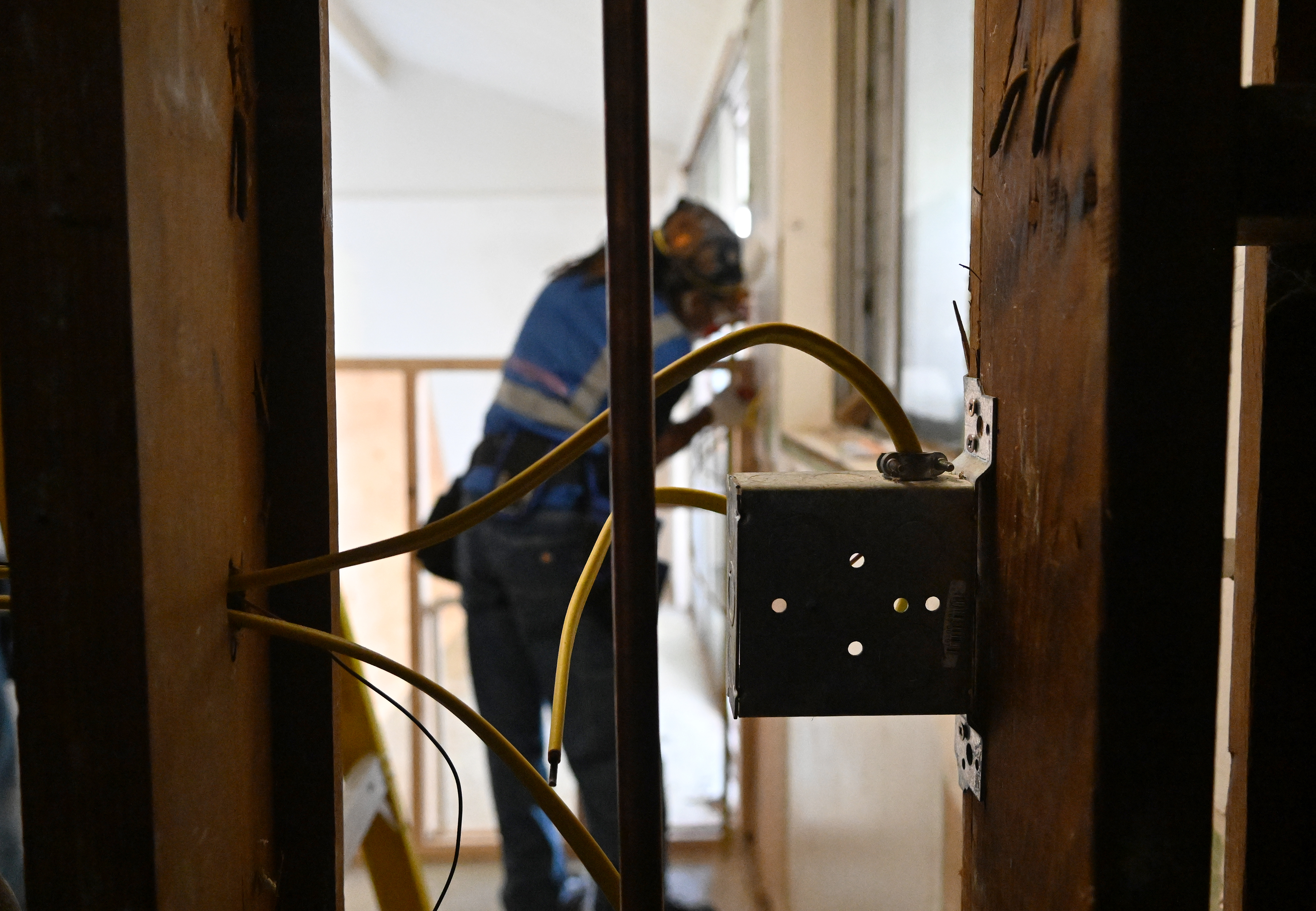Electrical wires in an exposed wall at an apartment under...